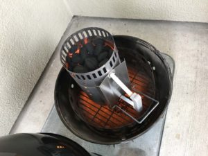 Lighting 30 briquets in a charcoal chimney