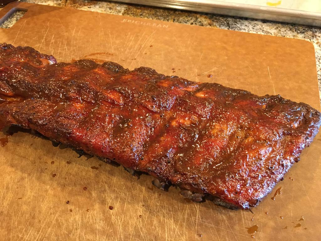 Easy baby back ribs with barbecue sauce applied